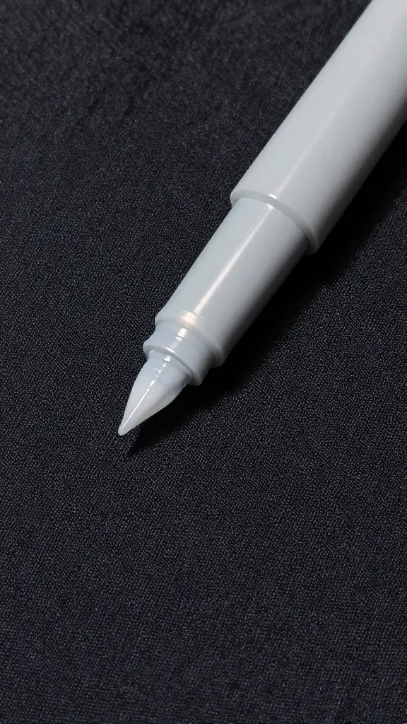 Closeup of water-soluble pen mark on dark polyester fabric