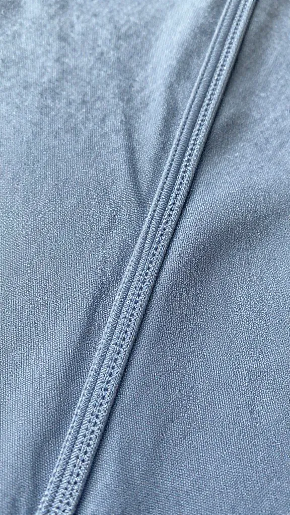 Closeup of a 1/4 inch seam allowance on jersey fabric