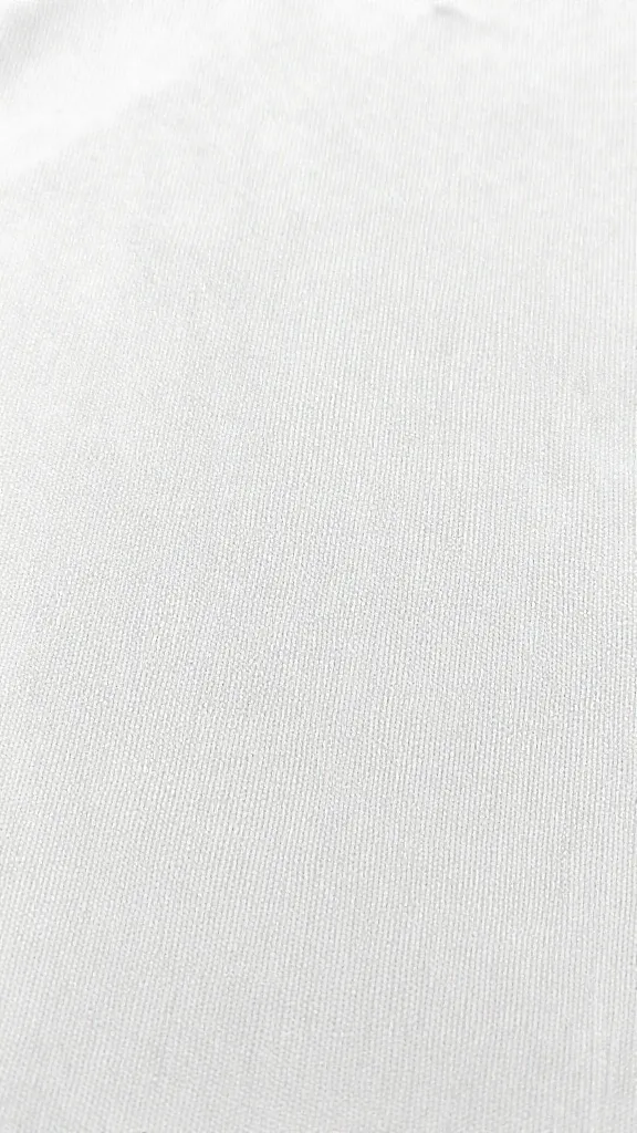 Close-up of cotton fabric texture on woven tee fabric
