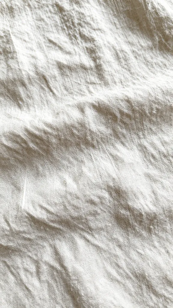 Close-up of linen fibers and natural wrinkles on hot-day shirt