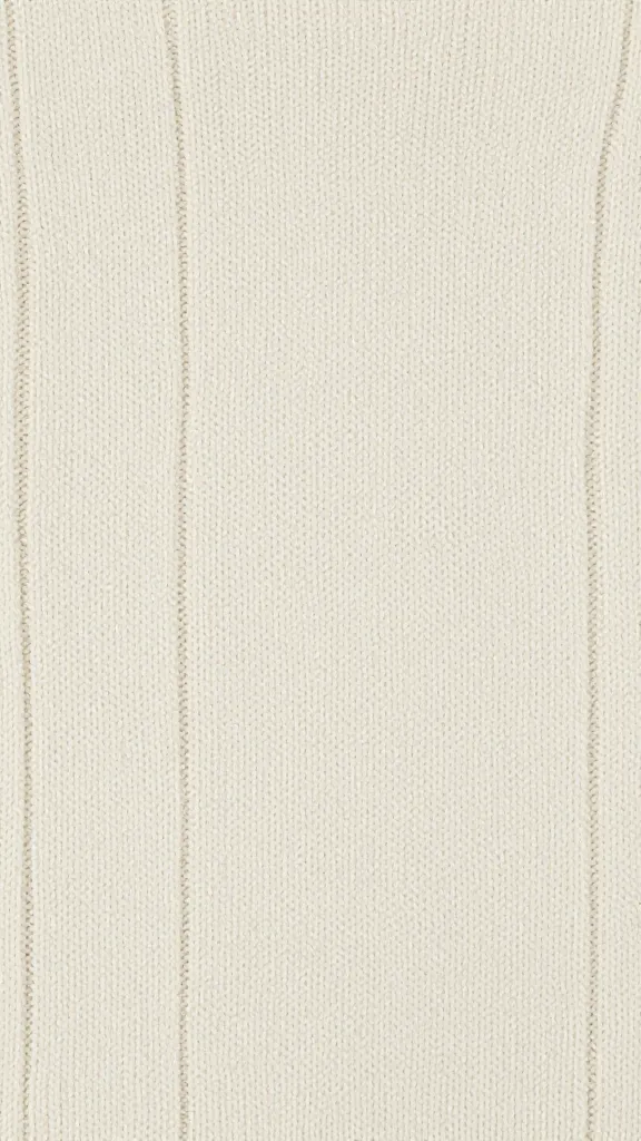 Close-up of wool knit pattern, soft lighting for sweater fabric